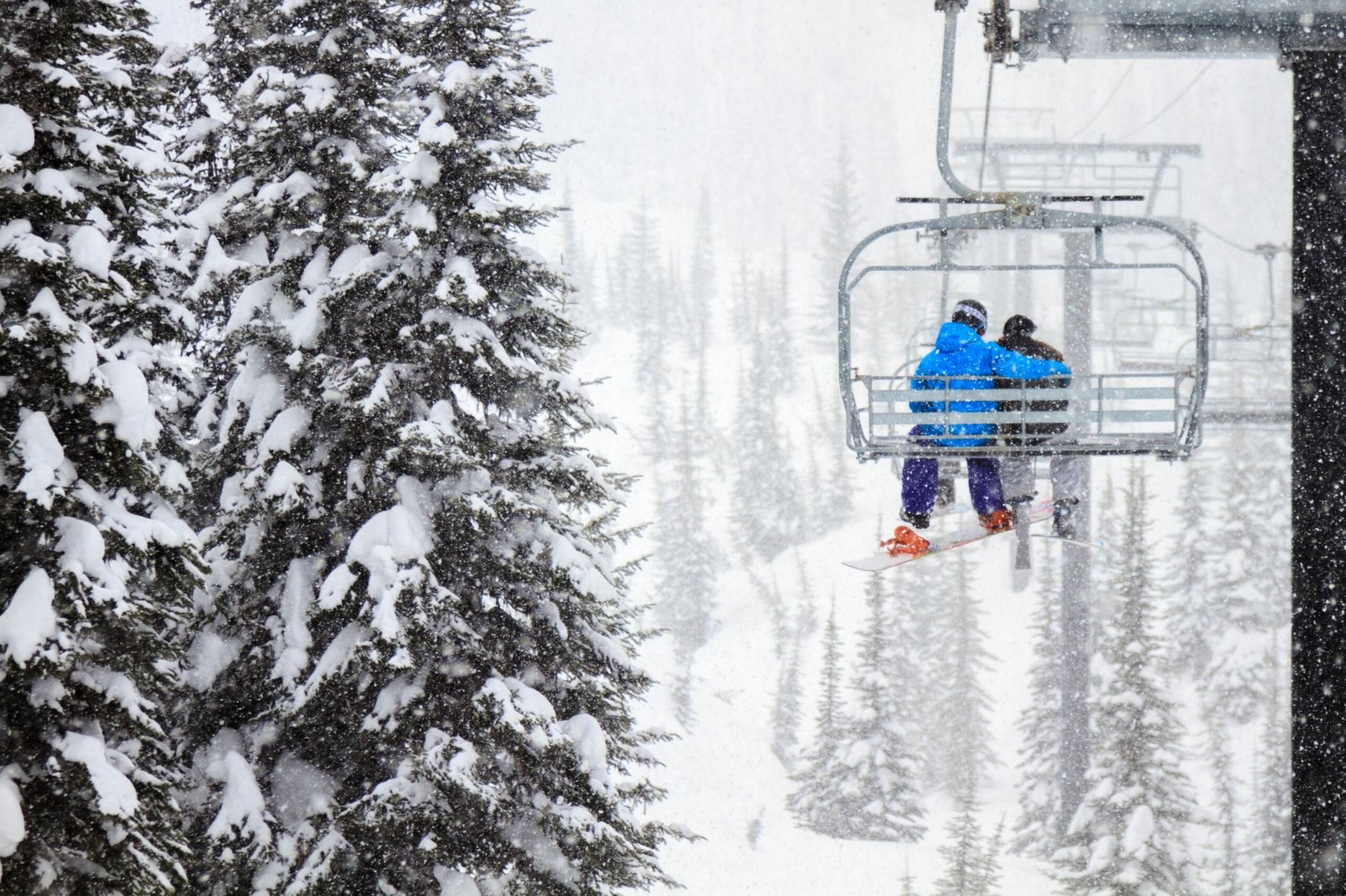 I snapped this photo a few year's ago of a snowboarder and a skier cuddling together on a snowy chairlift ride at the Whitefish Mountain Resort, Montana.
Learn how to process images like this one using Adobe Photoshop Lightroom and Adobe Photoshop CC at http://focusphotoschool.com